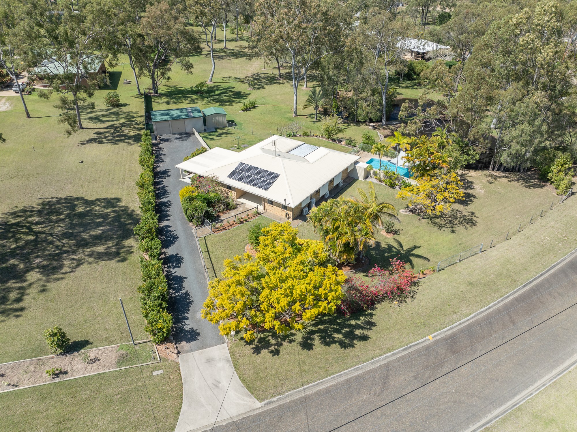 Dream Acreage Living With Pool, Shed & Solar!