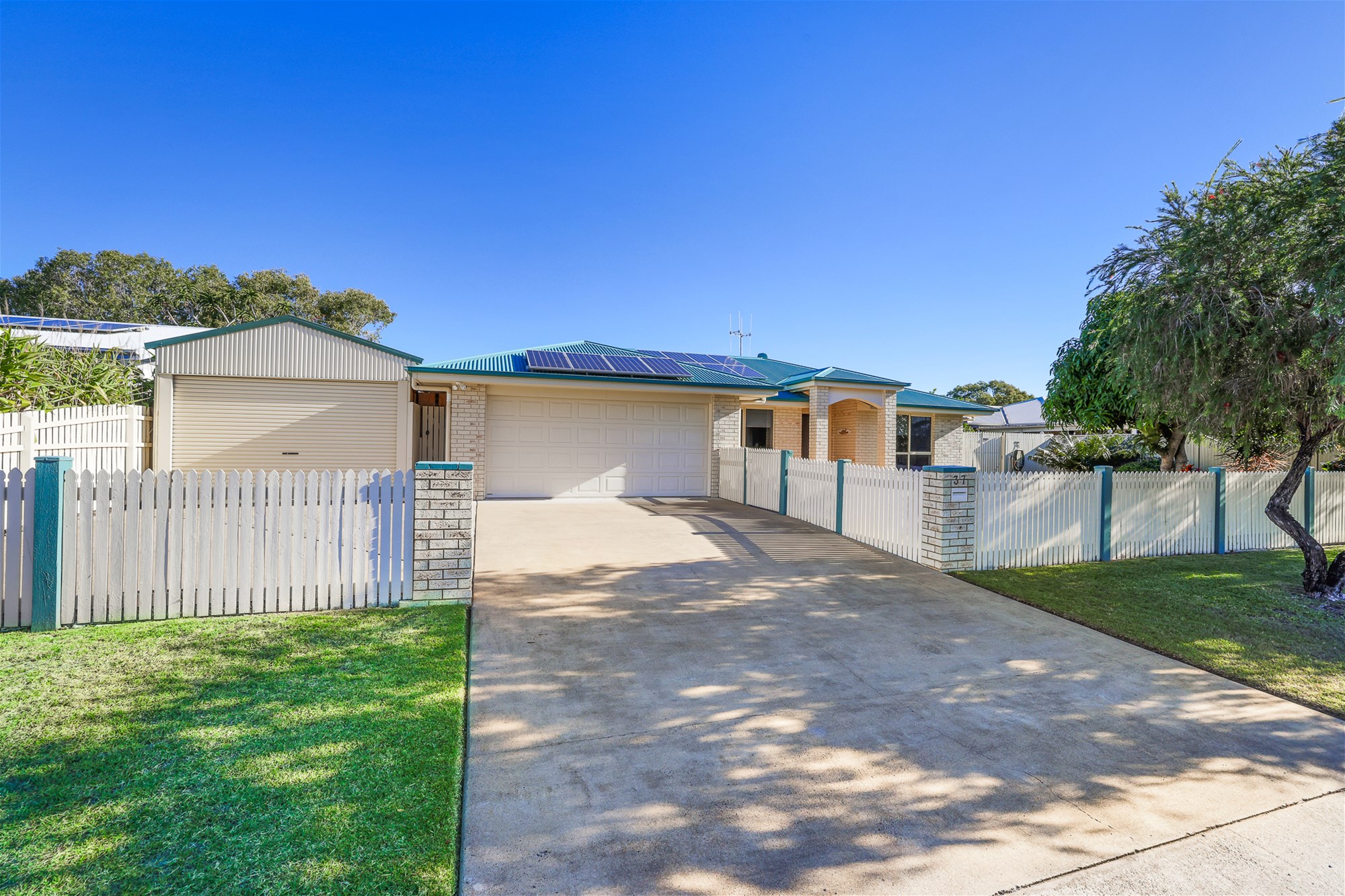 IMMACULATE COASTAL HOME WITH INGROUND POOL & MULTIPLE SHEDS